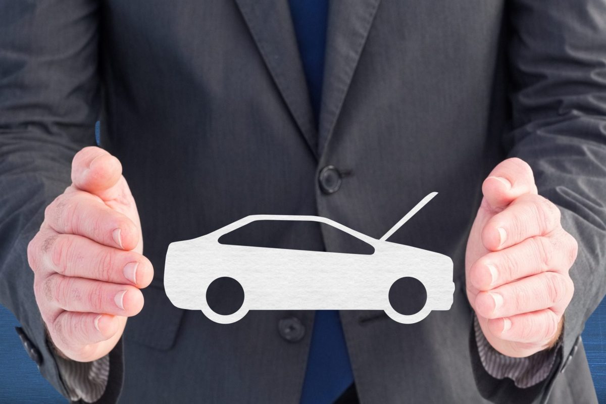Digital composite image of businessman pretending to hold vector car sign